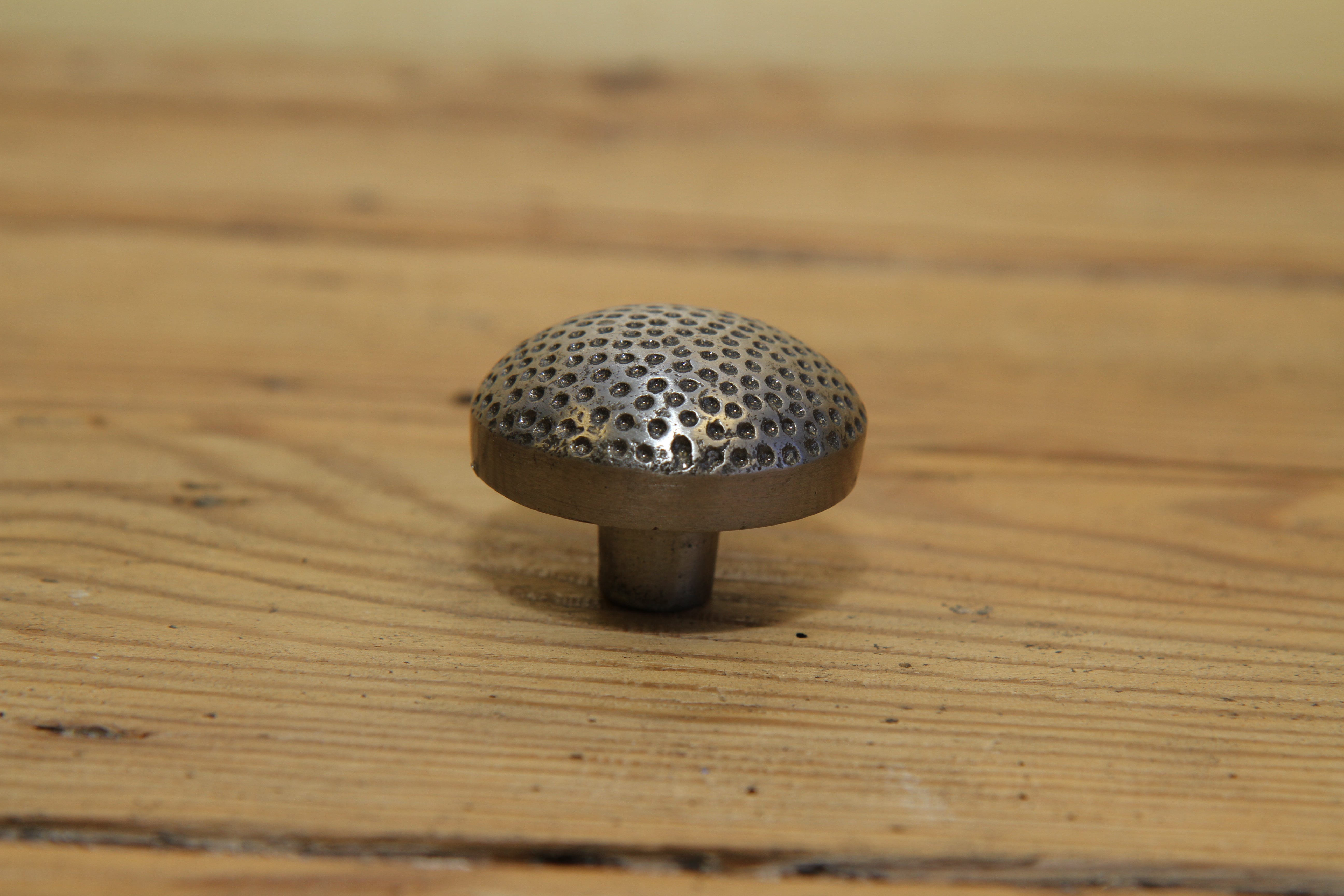 Cabinet Dimpled Knob. Celtic Finish. 33mm. Supplied with fixings.